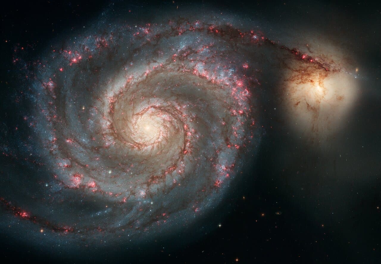 The Whirlpool Galaxy and its small companion, photographed by Hubble